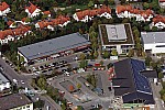 Einkaufszentrum und Gewerbegebiet an am Hainbuchenring in Neuried im Bundesland Bayern. Aldi, Rossmann Drogeriemarkt, KIK, TUI Reisecenter, GP Inspect, GPsolar